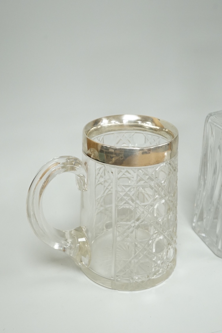 A late Victorian silver mounted cut glass mug, Saunders & Shepherd, Chester, 1899, height 13.4cm, together with a modern silver mounted cut glass decanter and a modern pair of silver 'Whisky' and 'Brandy' wine labels, J.